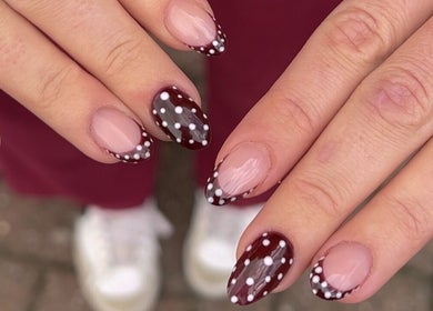 Stylish polka dot nails at Sunday Nail Club, Colchester, England, GB. Perfect blend of elegance and modern flair.