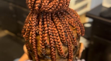Intricate braid style at Natural Beauty by Jeanette in Charlotte, North Carolina, US.