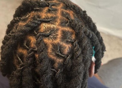 Intricate braided hairstyle at Natural Beauty by Jeanette, Charlotte, North Carolina, US.