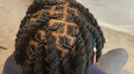 Intricate braided hairstyle at Natural Beauty by Jeanette, Charlotte, North Carolina, US.