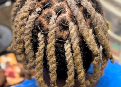 Dreadlock hairstyle at Natural Beauty by Jeanette in Charlotte, North Carolina, US.