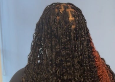 Intricate braided hairstyle at Natural Beauty by Jeanette, Charlotte, North Carolina, US.