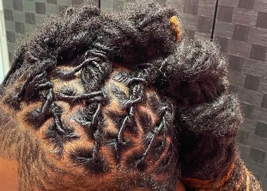 Intricate hair braiding at Natural Beauty by Jeanette, Charlotte, North Carolina, US.