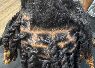 Close-up of stylish twisted hair at Natural Beauty by Jeanette in Charlotte, North Carolina, US.