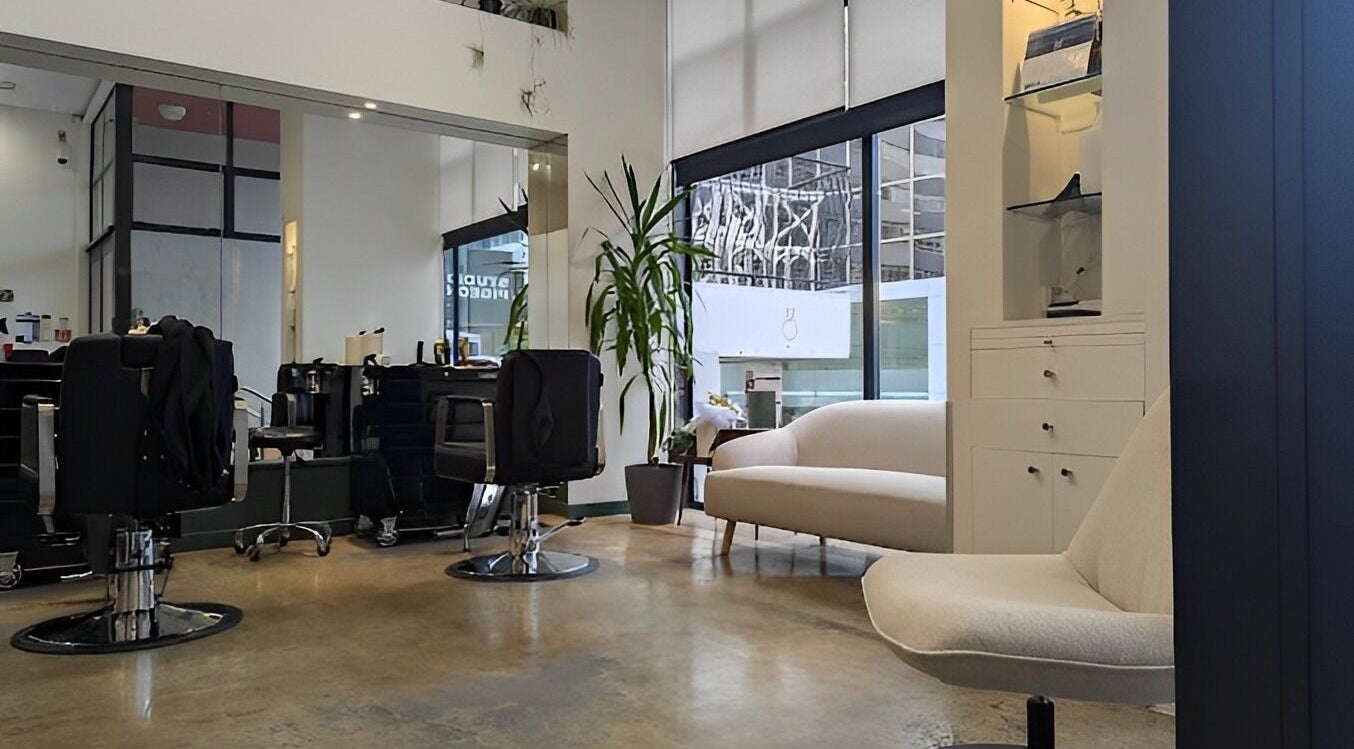 Interior of French Cut salon in Wellington, NZ showcasing stylish chairs and modern decor.