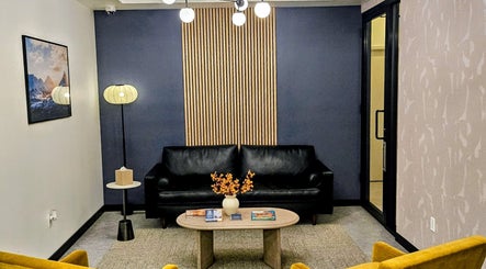 Elegant lounge at Laser 'n' Beyond - Chelsea NYC, New York, US with modern decor and cozy seating.