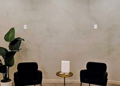 Sleek lounge at Laser 'n' Beyond - Chelsea NYC with chairs, plant, New York, New York, US.