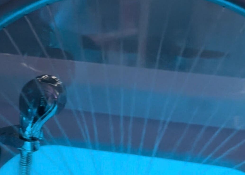 Modern faucet with blue lighting at Smooth n Shine Beautyz, Bradford, England, GB.