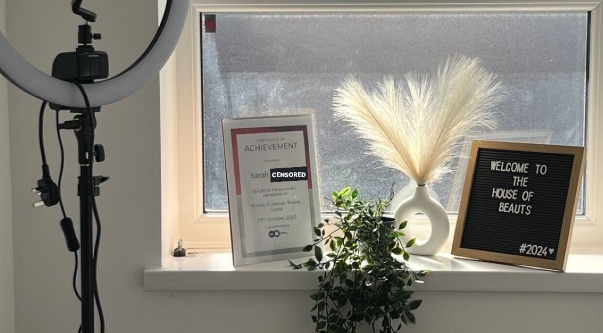 Welcome sign and certificate at The House of Beauts, Barking, England, GB, showcasing a chic, inviting interior.