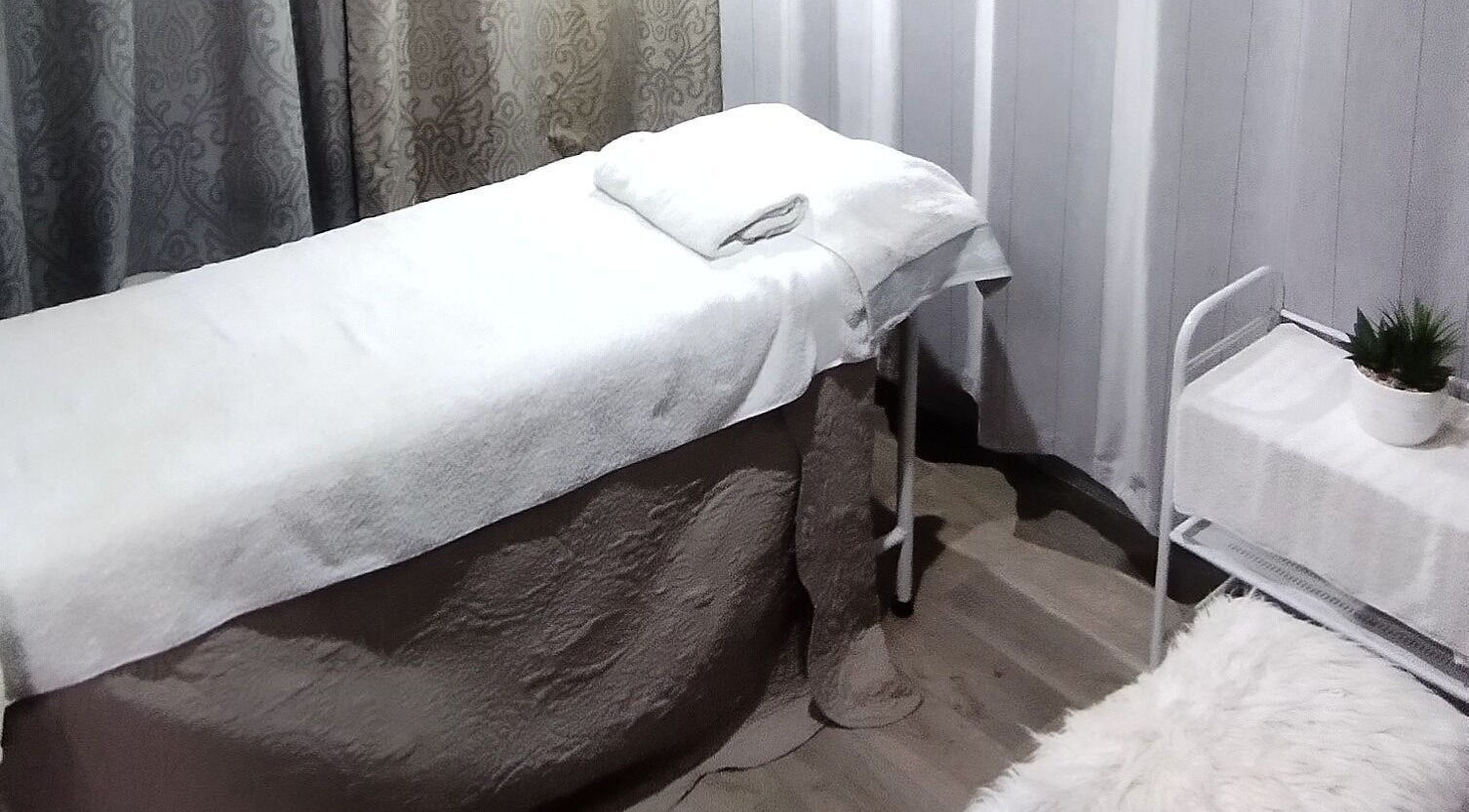 Elegant treatment room at 24KaratGLAM, Cape Town, Western Cape, ZA, offering serene relaxation.