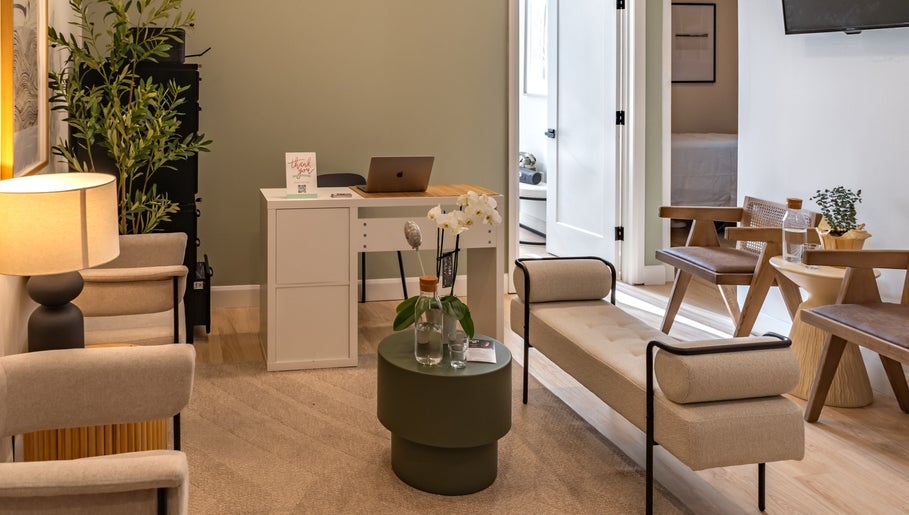 Relaxing lounge at Royal York Holistic Med Spa, Toronto, Ontario, CA, with cozy seating and serene decor.