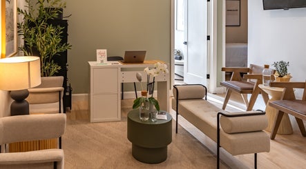 Relaxing lounge at Royal York Holistic Med Spa, Toronto, Ontario, CA, with cozy seating and serene decor.