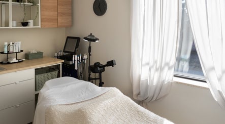 Calming treatment room at Royal York Holistic Med Spa, Toronto, Ontario, CA, with soft lighting and comfortable setup.