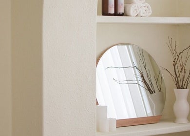 Decorative shelf at Royal York Holistic Med Spa, Toronto, Ontario, CA with mirror and vase.