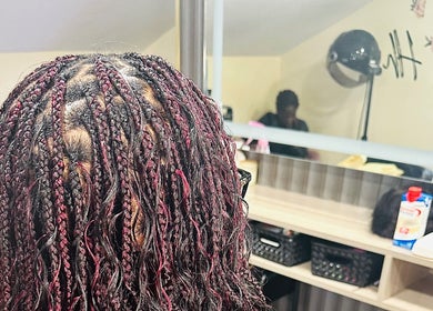 Intricate braids styled at Zeehair Salon, Ajax, Ontario, CA, reflecting expert hair care.