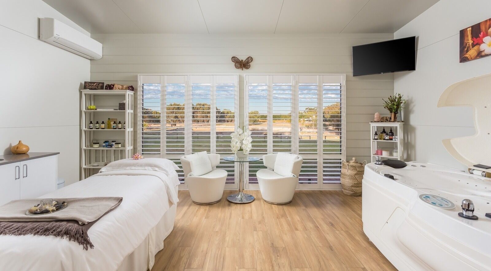Relaxing spa room at Swan Valley Retreat in Henley Brook, Western Australia, featuring a massage bed and jacuzzi.