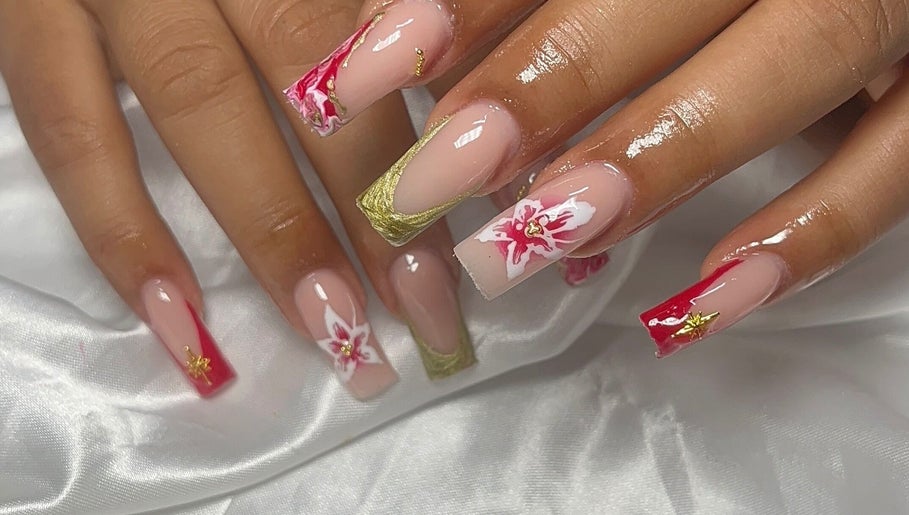 Elegant floral nail art at Nails by Frankie, Chicago, Illinois, US. Red and gold accents on a satin background.