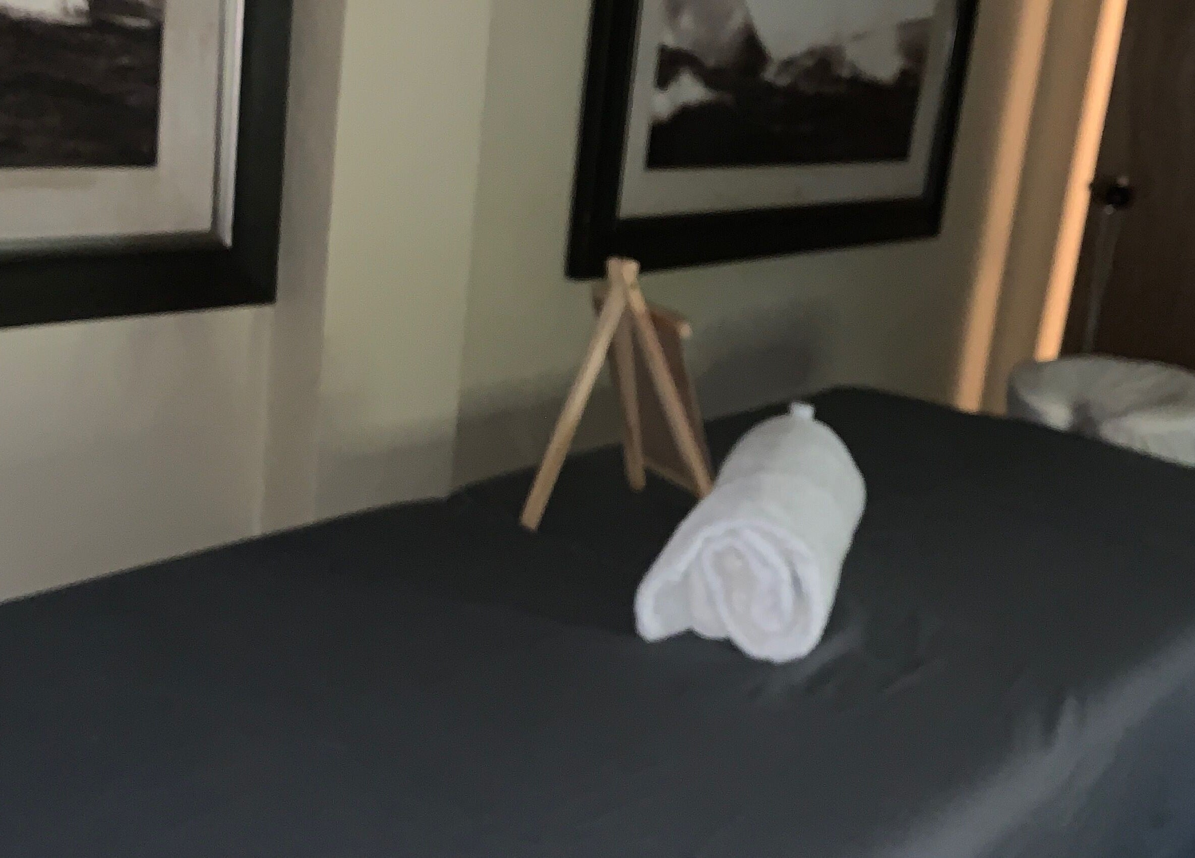 Relaxing massage room at Glam Harmony Day Spa, Dennery, LC, featuring a cozy treatment bed and calming decor.