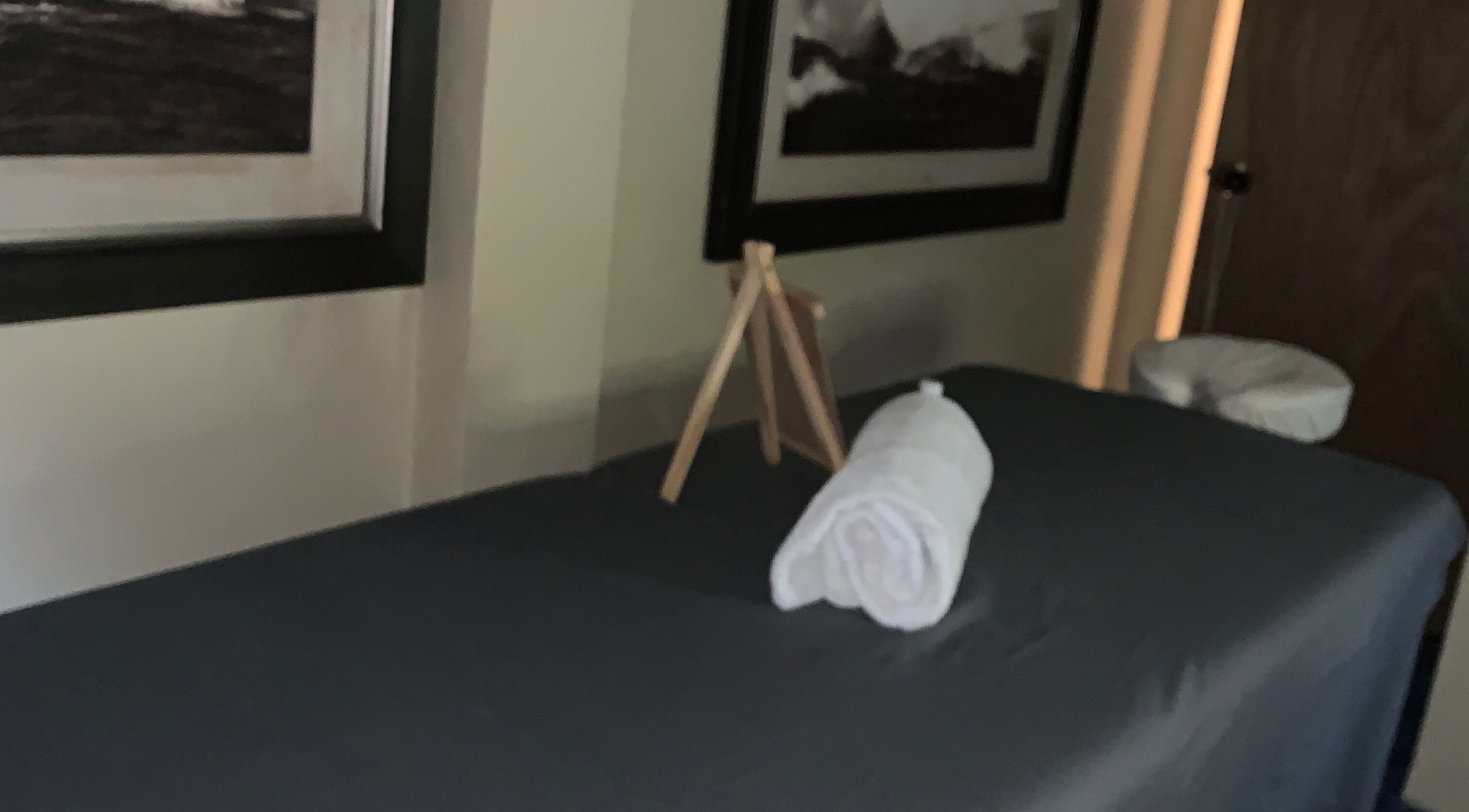 Relaxing massage room at Glam Harmony Day Spa, Dennery, LC, featuring a cozy treatment bed and calming decor.