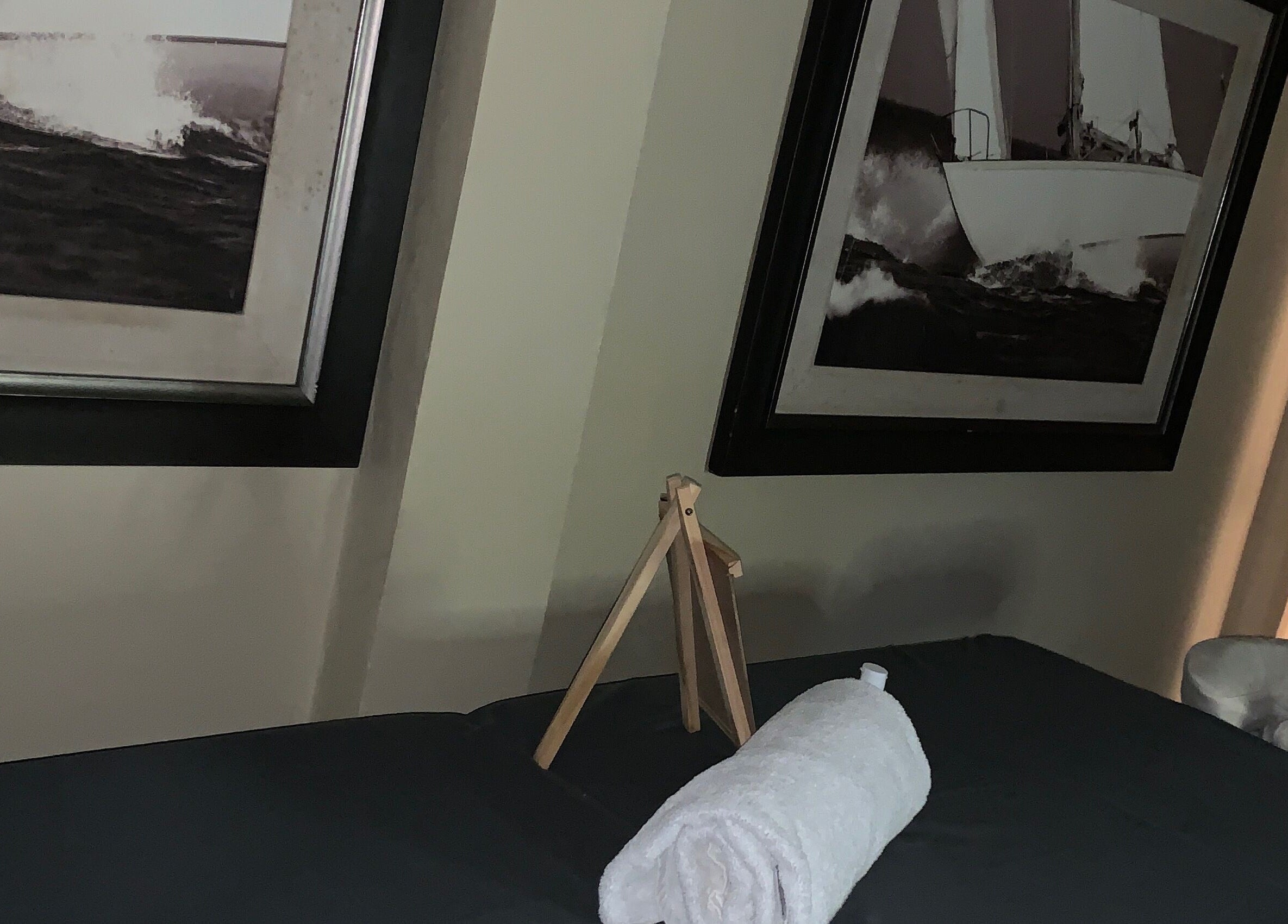 Relaxing massage room at Glam Harmony Day Spa, Dennery, LC with nautical art decor.