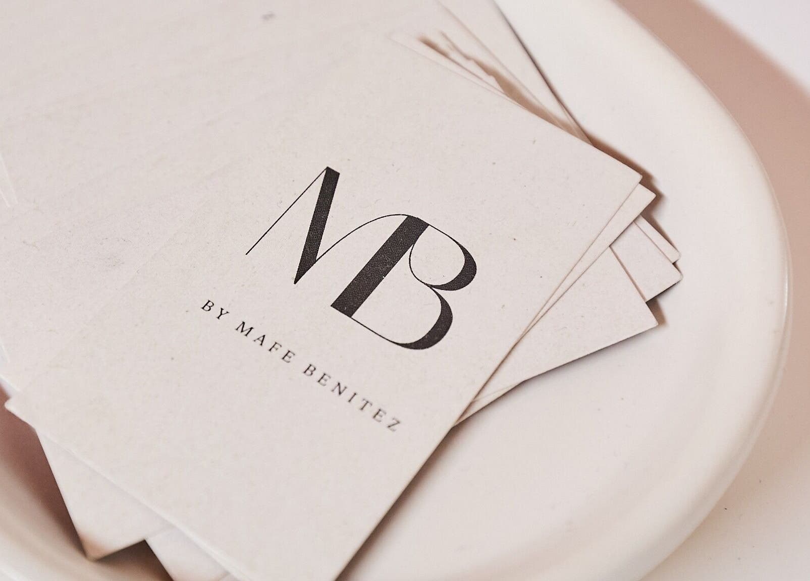 Maria Benitez Nails Studio business card on white plate, Rosebery, New South Wales, AU.