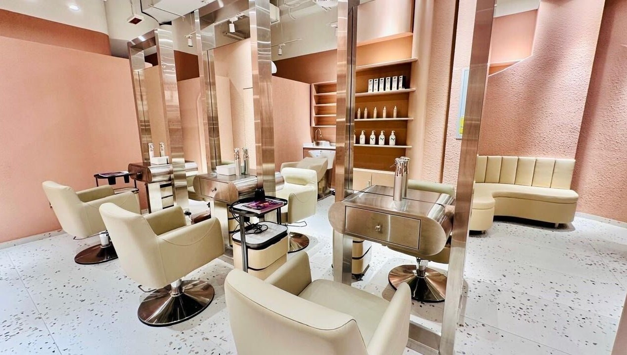 Elegant interior of The Muse Beauty Space in Dubai, Dubai, AE, featuring modern salon chairs and sleek decor.