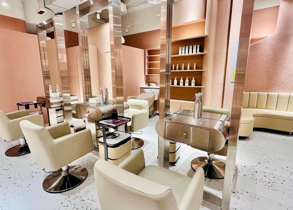 Elegant interior of The Muse Beauty Space in Dubai, Dubai, AE, featuring modern salon chairs and sleek decor.