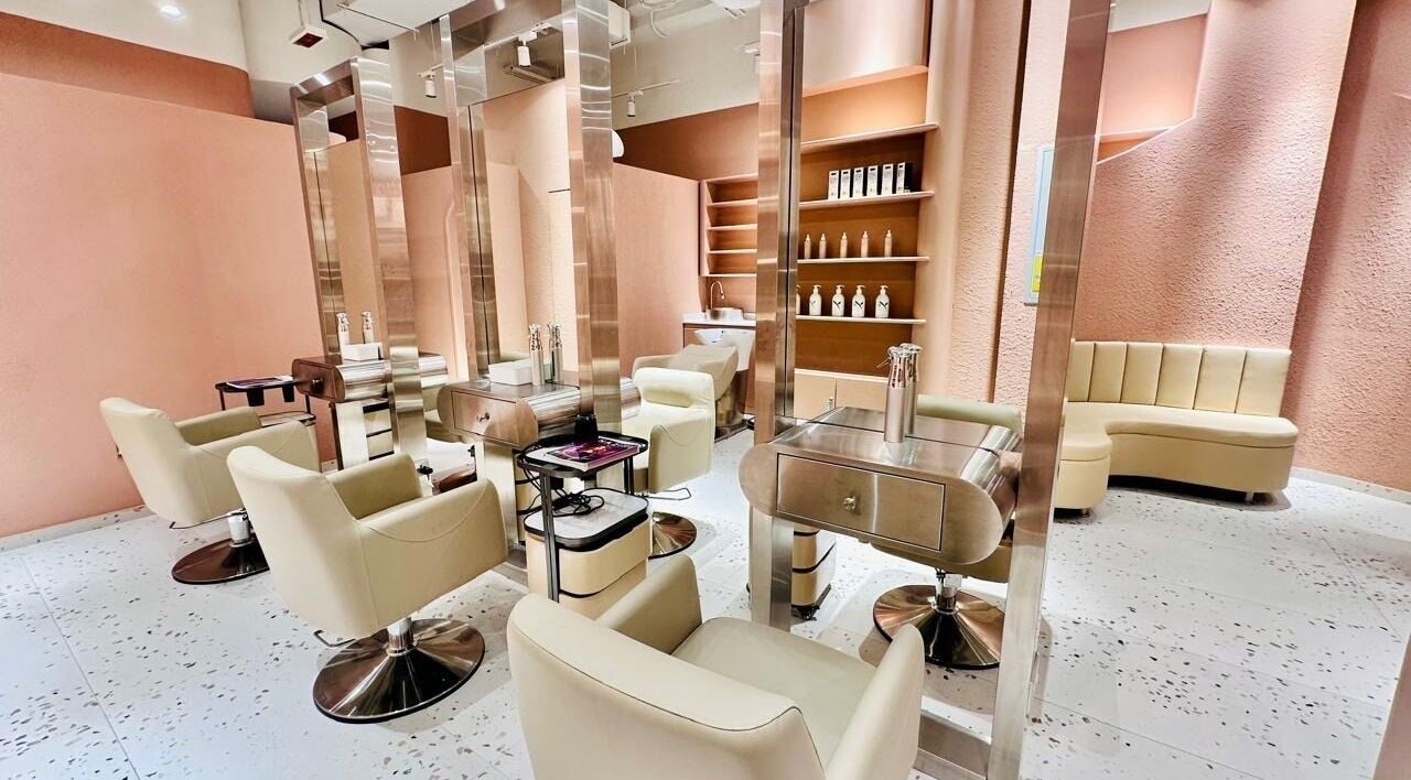 Elegant interior of The Muse Beauty Space in Dubai, Dubai, AE, featuring modern salon chairs and sleek decor.