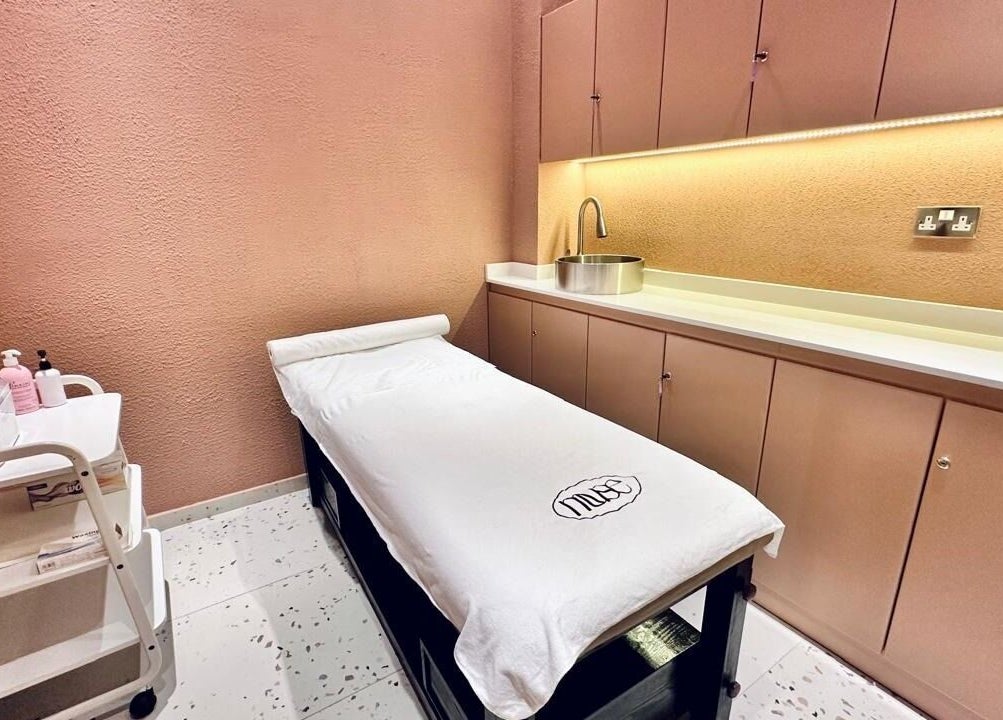 Relaxation room at The Muse Beauty Space, Dubai, Dubai, AE featuring a massage table and calming decor.