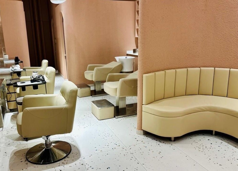 Chic salon setup at The Muse Beauty Space, Dubai, Dubai, AE with plush chairs and modern decor.