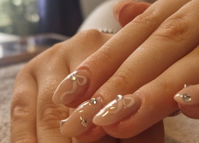 Elegant nail art with gems at Chloe's, Woodville, England, GB, showcasing intricate design and refinement.