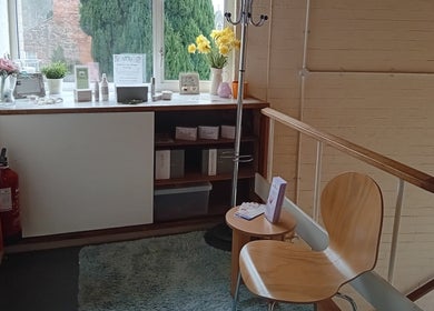 Welcoming seating area at Malvern Hills Beauty in Malvern, England, GB with decor and natural lighting.