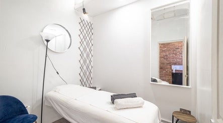 Serene treatment room at The Spa Culture, London, England, GB with massage table and soft lighting.