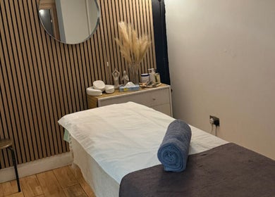 Relaxing treatment room at The Spa Culture, London, England, GB with a massage table and calming decor.