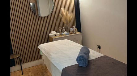 Relaxing treatment room at The Spa Culture, London, England, GB with a massage table and calming decor.