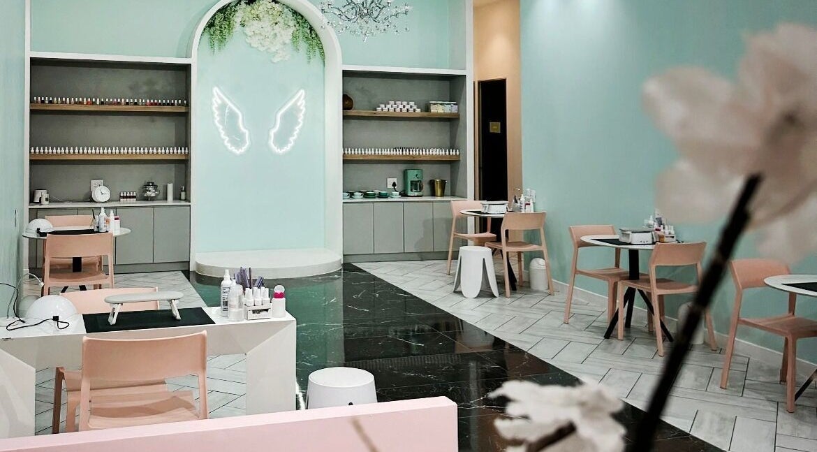 Chic interior of Voila Beauty Boutique, Cape Town, Western Cape, ZA, featuring pastel decor and stylish seating.