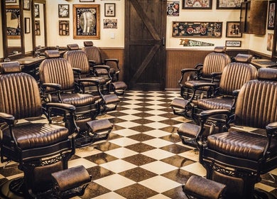 Vintage barber chairs at FIGARO BARBERSHOP LEUCADIA, Encinitas, California, US showcasing a warm, classic style.