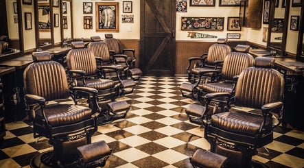 Vintage barber chairs at FIGARO BARBERSHOP LEUCADIA, Encinitas, California, US showcasing a warm, classic style.
