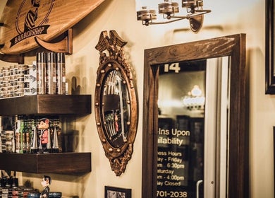 Vintage grooming products on shelves at FIGARO BARBERSHOP LEUCADIA, Encinitas, California, US.