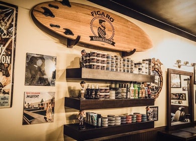 FIGARO BARBERSHOP LEUCADIA in Encinitas, California, features a vintage decor with surfboard and grooming products.