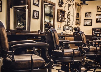 Interior view of stylish FIGARO BARBERSHOP LEUCADIA in Encinitas, California, US, featuring vintage barber chairs.