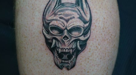 Intricate skull tattoo at Z A Tattoo, Bolton, England, GB, showcasing fine detail and artistry.