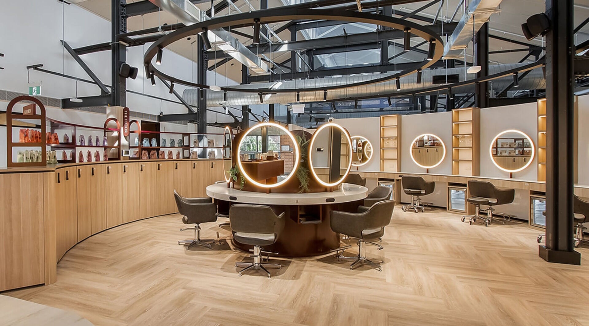 Modern salon interior at Lanna Hairstylist, West End, Queensland, AU. Elegant mirrors and seating create a stylish ambiance.