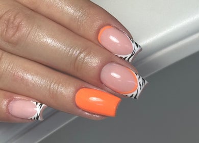 Vibrant orange and zebra nail art at Beauty Studio by Ellie Cook, Havant, England, GB.