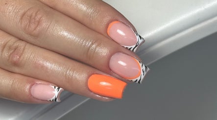 Vibrant orange and zebra nail art at Beauty Studio by Ellie Cook, Havant, England, GB.