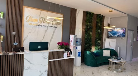 Reception area at Glam Haus Clinic, Coventry, England, GB, featuring modern decor and elegant seating.