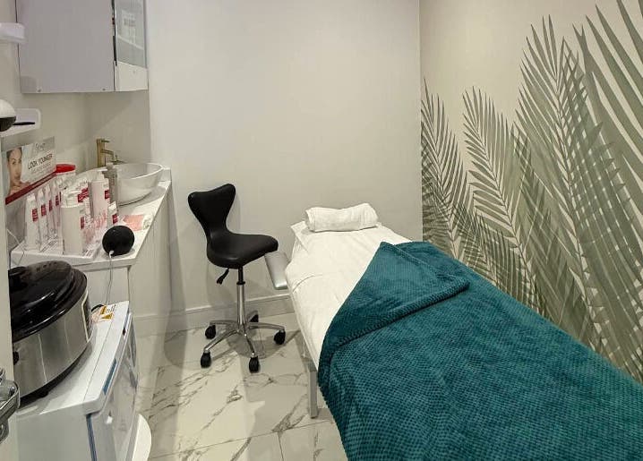 Relaxing treatment room at Glam Haus Clinic, Coventry, England, GB, featuring a spa bed and soothing decor.