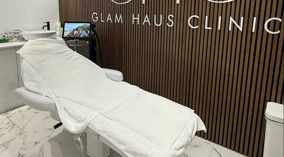 Serene treatment room at Glam Haus Clinic in Coventry, England, GB with modern aesthetics equipment.