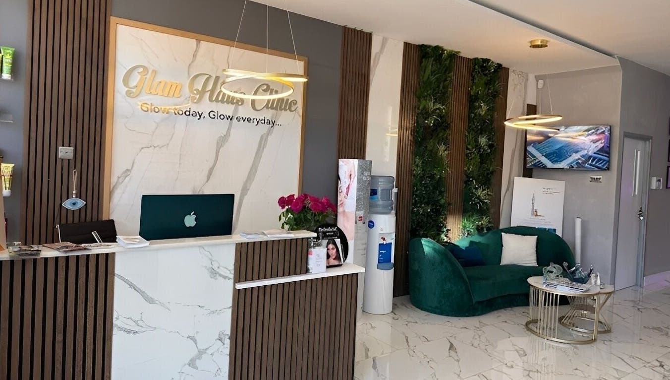 Elegant reception at Glam Haus Clinic, Coventry, England featuring modern decor and plush seating.