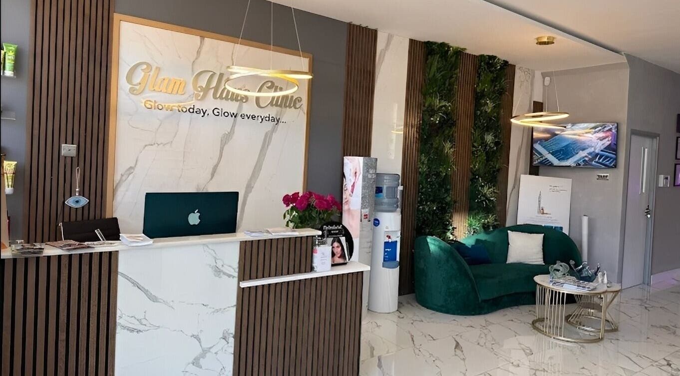Elegant reception at Glam Haus Clinic, Coventry, England featuring modern decor and plush seating.
